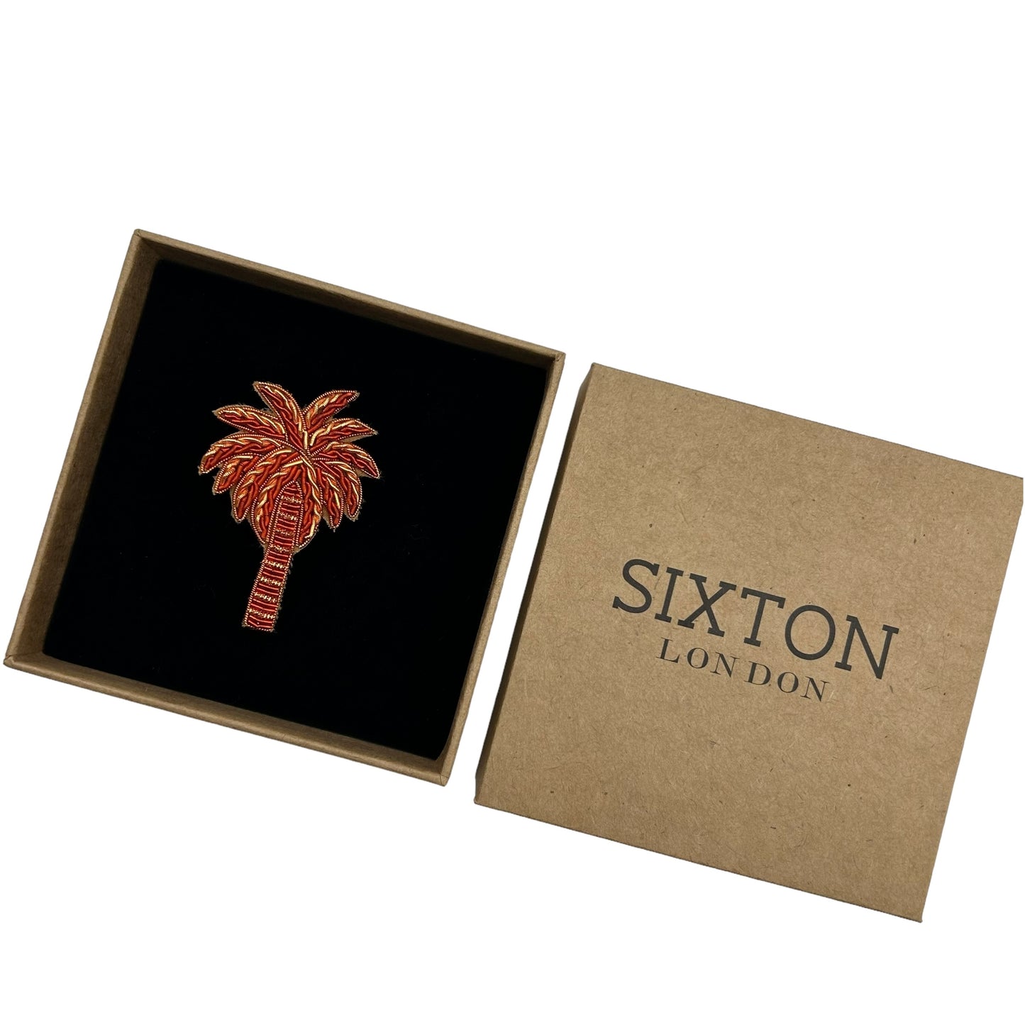 Coral palm tree brooch