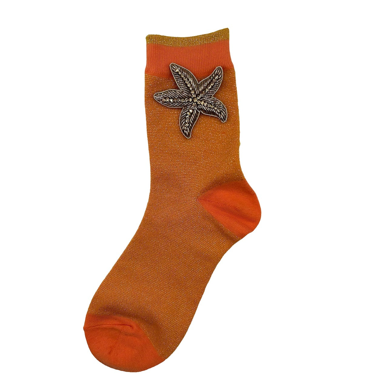 Tokyo socks in cantaloupe with a star fish brooch