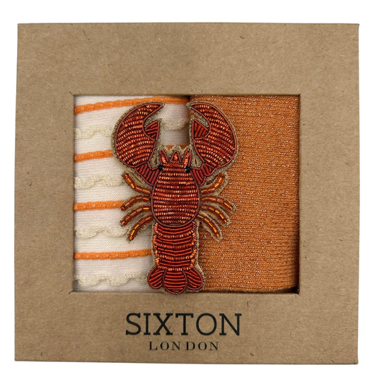 Cream Lyon & Orange Vegas sock box duo with embroidered brooch