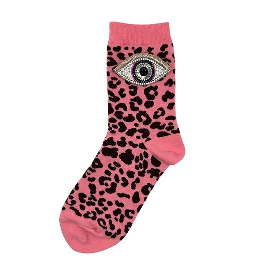 Leopard socks in pink with a golden eye brooch