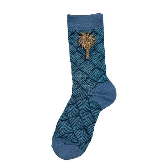 Paris socks in blue with a palm tree brooch