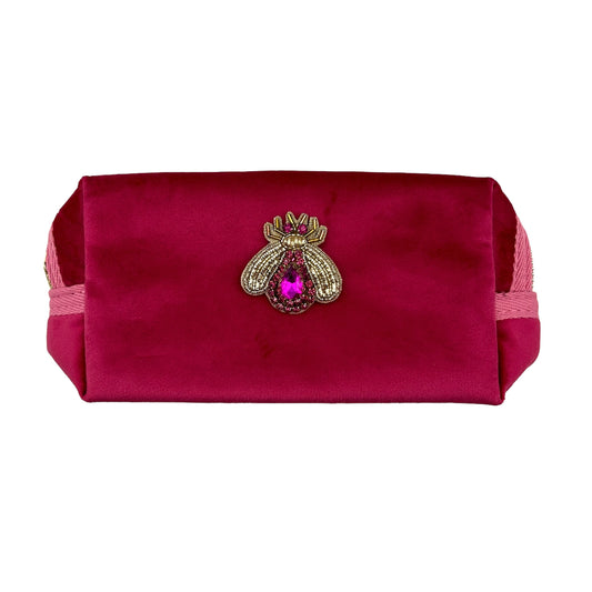 Bright pink makeup bag with Jewelled Insect brooch