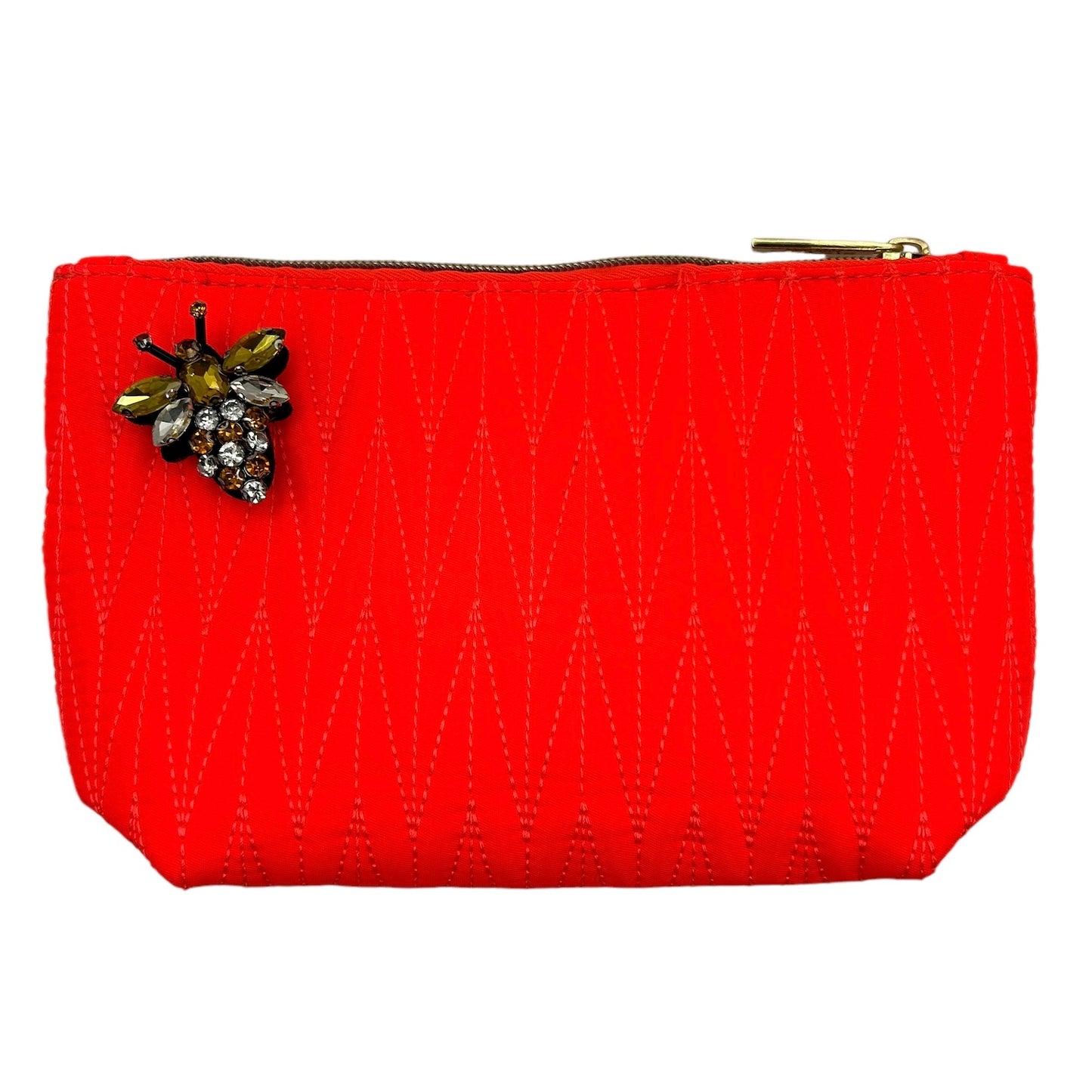 Orange Tribeca make up bag with a queen bee pin