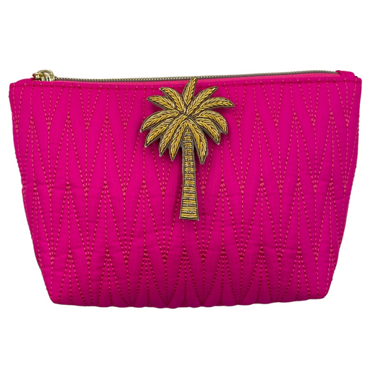 Bright pink Tribeca make up bag with palm tree pin