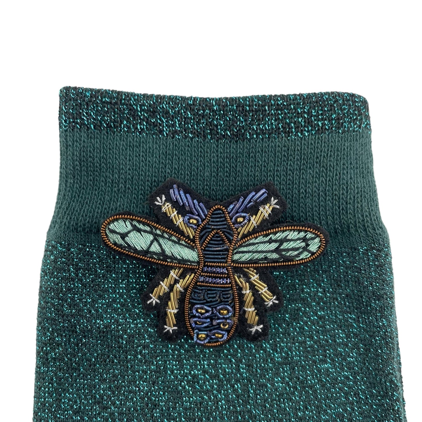 Tokyo socks in teal with a petite insect pin