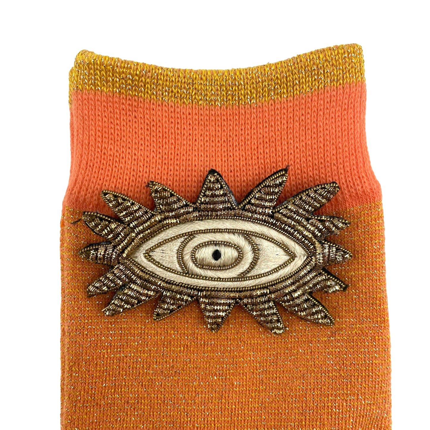 Tokyo socks in cantaloupe with a metallic eyes brooch