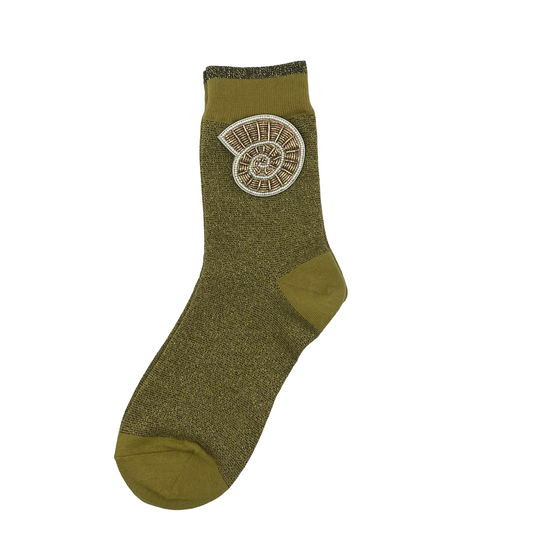Tokyo socks in olive with a spiral shell brooch